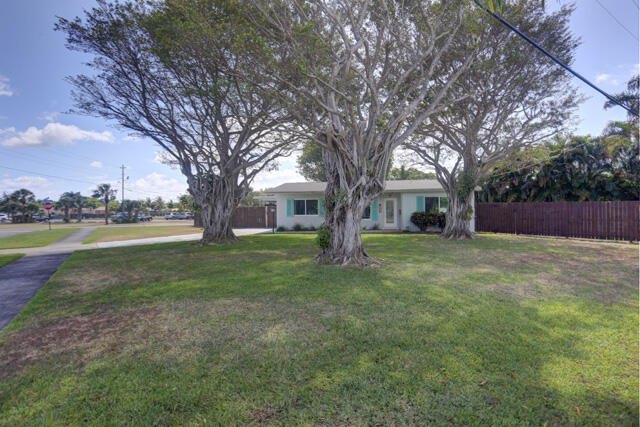 Roof 2020, impact glass, .31 acre corner lot with huge fenced - Beach Home for sale in Lake Park, Florida on Beachhouse.com