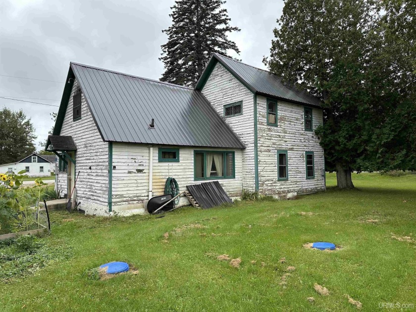 Move right in and update as you go, or roll up your sleeves and - Beach Home for sale in Manistique, Michigan on Beachhouse.com