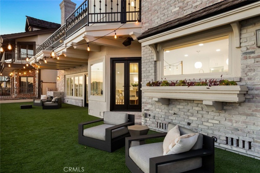 With a premium waterfront setting on Trinidad Island overlooking - Beach Home for sale in Huntington Beach, California on Beachhouse.com