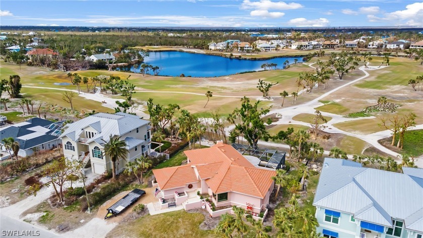 This partially elevated home offers stunning views of multiple - Beach Home for sale in Sanibel, Florida on Beachhouse.com