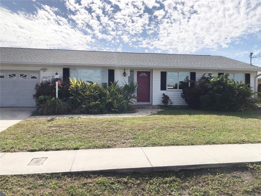 Impressive WATERFRONT POOL HOME offers QUICK SAILBOAT access to - Beach Home for sale in Port Charlotte, Florida on Beachhouse.com