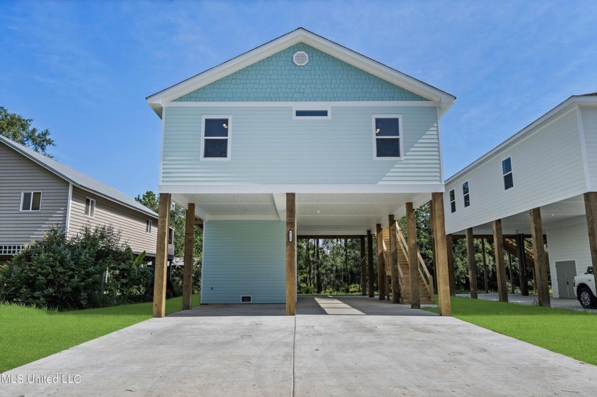 This beautiful canal front home offers a serene setting on a - Beach Home for sale in Bay Saint Louis, Mississippi on Beachhouse.com