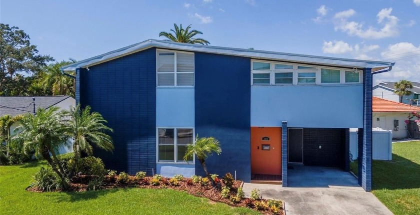 Step into a beautifully reimagined Mid-Century Modern gem--one - Beach Home for sale in Tampa, Florida on Beachhouse.com