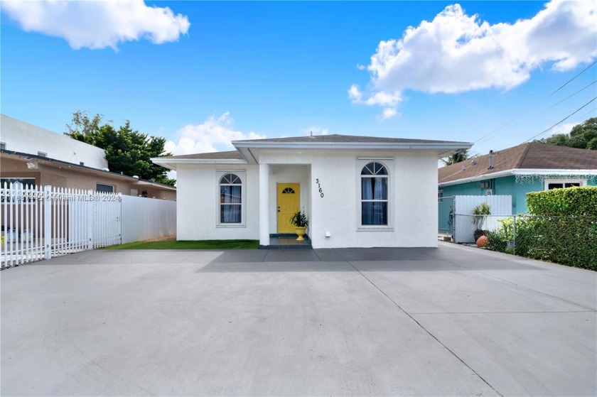 Welcome to this inviting 3-bedroom, 2-bath home featuring a - Beach Home for sale in Miami, Florida on Beachhouse.com