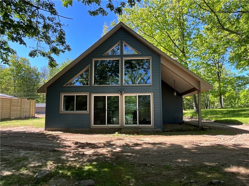A-Frame style home overlooking Johnson Creek which is accessible - Beach Home for sale in Waterport, New York on Beachhouse.com