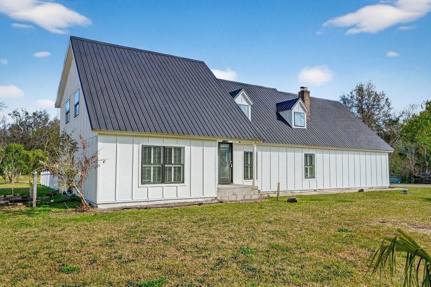 Nestled on a sprawling 1.35-acre estate lot in one of Port - Beach Home for sale in Port Orange, Florida on Beachhouse.com