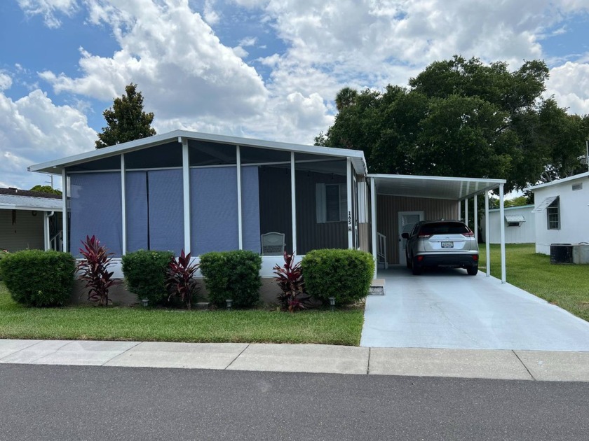 This charming, updated, manufactured home is nestled in the - Beach Home for sale in Holly Hill, Florida on Beachhouse.com