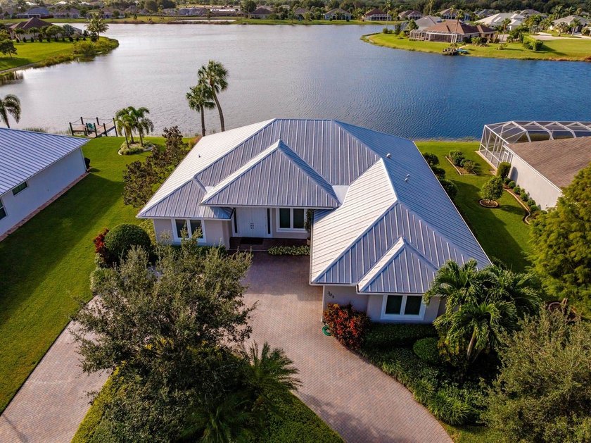 3BR/2BA/2CG lakefront home, circular driveway w/impeccable lush - Beach Home for sale in Sebastian, Florida on Beachhouse.com