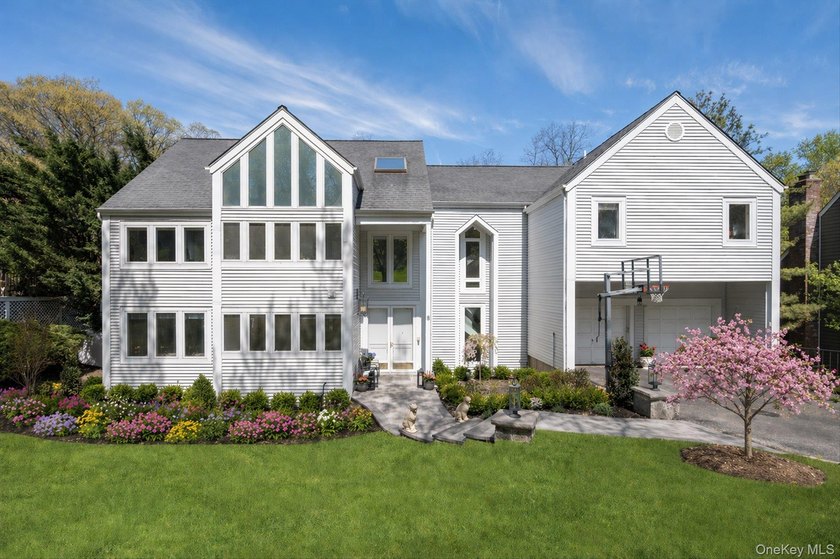 Privately set on .49 acres at the end of a cul-de-sac, this - Beach Home for sale in Roslyn, New York on Beachhouse.com