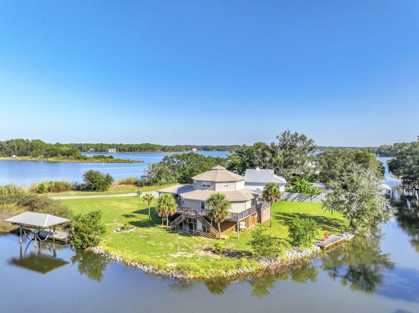 Set on 3/4 acre and surrounded by 300 feet of waterfront you - Beach Home for sale in Freeport, Florida on Beachhouse.com