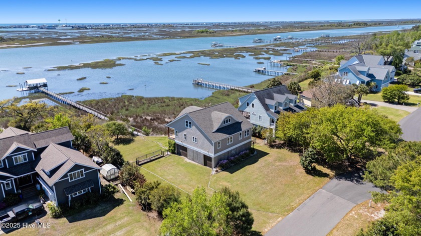 Nestled along 100 feet of pristine waterfront, this exceptional - Beach Home for sale in Hampstead, North Carolina on Beachhouse.com