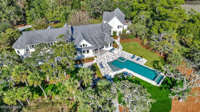 Introducing this exceptional 4-bedroom, 5.5-bath estate, nestled - Beach Home for sale in Bluffton, South Carolina on Beachhouse.com