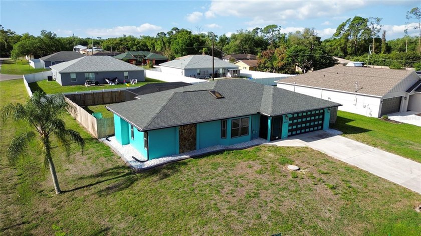 Welcome to this BEAUTIFULLY UPDATED SALTWATER POOL HOME located - Beach Home for sale in Port Charlotte, Florida on Beachhouse.com