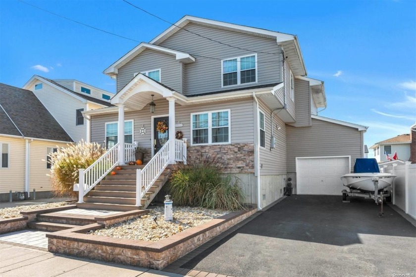 Gorgeous waterfront property featuring 2 boat slips and 50 feet - Beach Home for sale in Lindenhurst, New York on Beachhouse.com