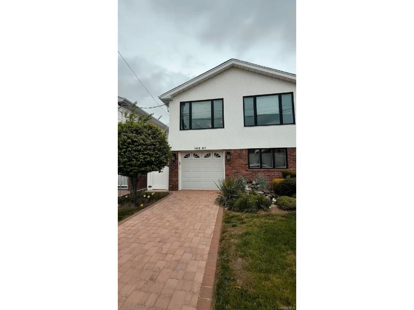 This Beautifully Updated High Ranch Empire Style Home In the - Beach Home for sale in Howard Beach, New York on Beachhouse.com
