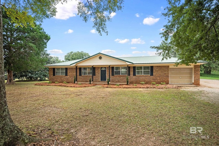 Set on 2.3 quiet acres, this classic brick ranch captures the - Beach Home for sale in Robertsdale, Alabama on Beachhouse.com
