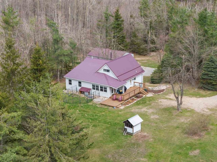 This exceptional home sits on a tranquil just under 5-acre - Beach Home for sale in Harbor Springs, Michigan on Beachhouse.com