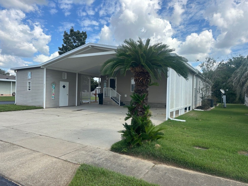 Located in the Foley Grove, a charming land-leased 55+ - Beach Home for sale in Foley, Alabama on Beachhouse.com