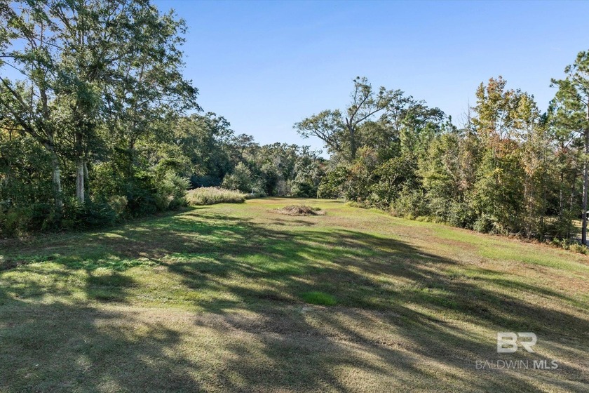 Discover the peaceful charm of Windy Oaks, a well-established - Beach Lot for sale in Grand Bay, Alabama on Beachhouse.com