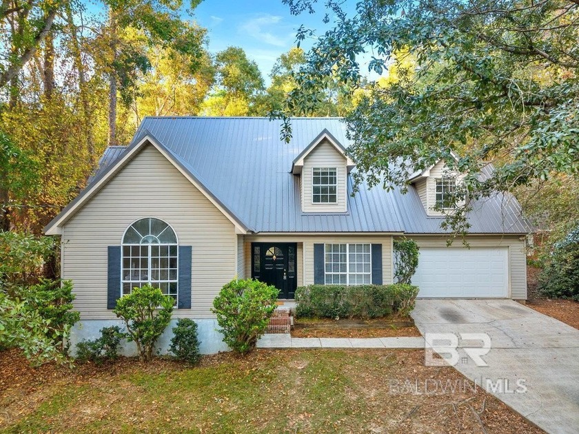 Step into this spacious 5-bedroom, 2.5-bath home where a - Beach Home for sale in Daphne, Alabama on Beachhouse.com