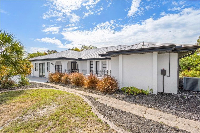 Spacious and versatile 6-bedroom, 3.5-bath home includes - Beach Home for sale in Port Charlotte, Florida on Beachhouse.com