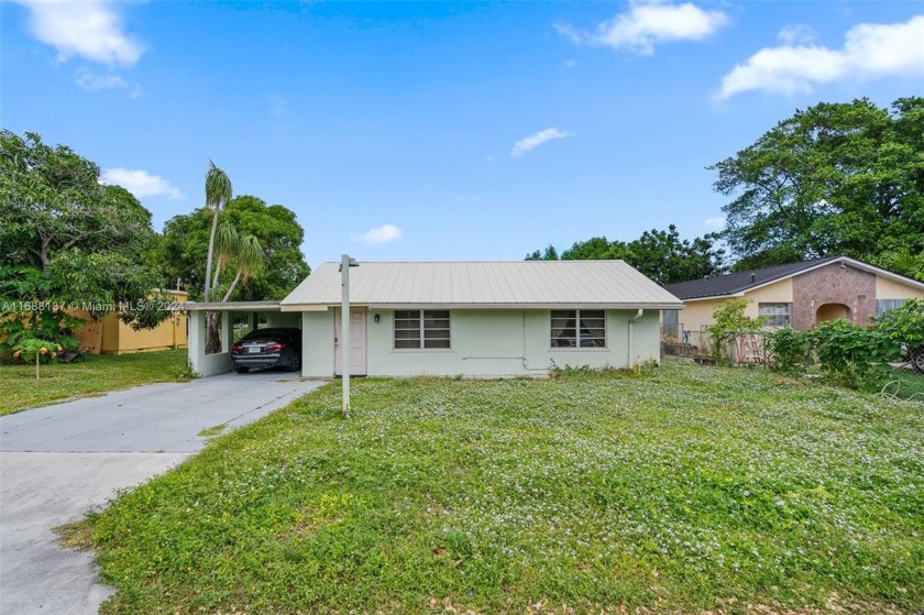 This beautifully remodeled home boasts a spacious open layout - Beach Home for sale in Lake Worth, Florida on Beachhouse.com