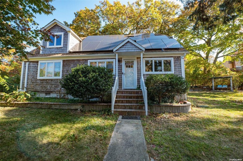 Welcome to this bright and airy 3-bedroom, 2-bathroom retreat - Beach Home for sale in Rocky Point, New York on Beachhouse.com