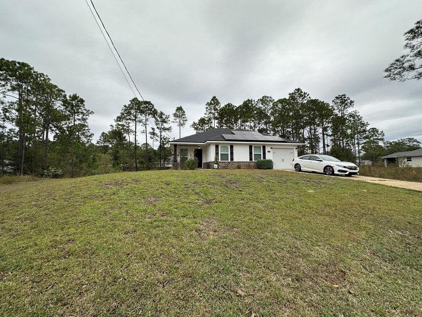 Beautifully maintained 2020-built Craftsman-style home located - Beach Home for sale in Gulf Breeze, Florida on Beachhouse.com