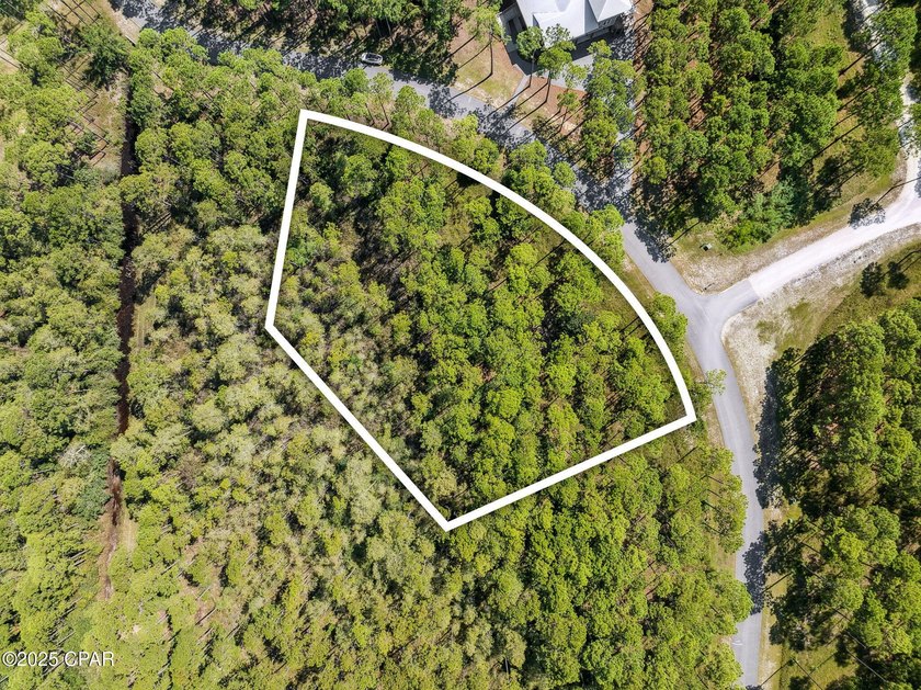 Tucked inside the private, gated community of RiverCamps, this - Beach Lot for sale in Panama City Beach, Florida on Beachhouse.com