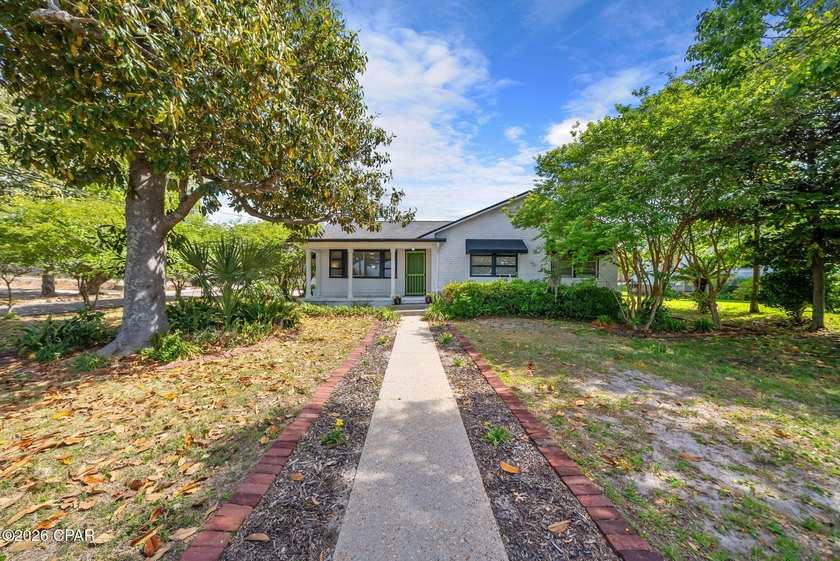 This charming home sits on a beautiful tree-lined corner lot in - Beach Home for sale in Panama City, Florida on Beachhouse.com