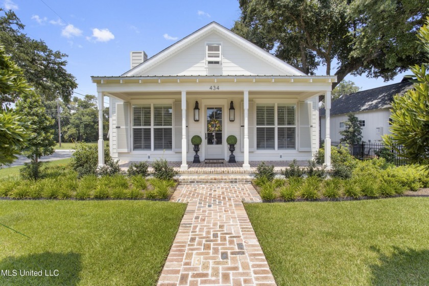 This home is a masterpiece of design and functionality! The - Beach Home for sale in Gulfport, Mississippi on Beachhouse.com