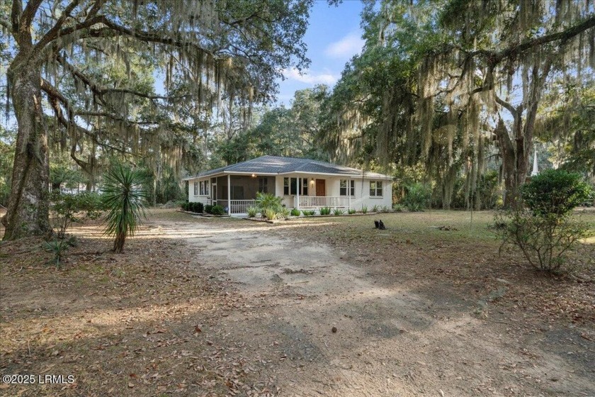 Looking for a charming coastal retreat? Don't miss this retro - Beach Home for sale in Saint Helena Island, South Carolina on Beachhouse.com