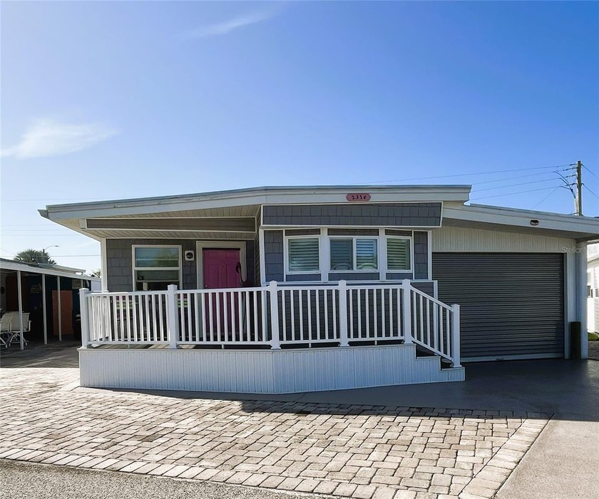 This charming 2-bedroom home features a roll-down garage door - Beach Home for sale in Bradenton, Florida on Beachhouse.com