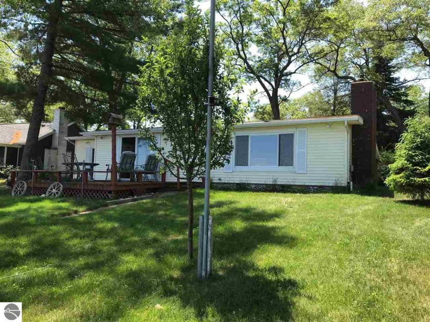 Check out the lakeside yard and view of the lake on this one - Beach Home for sale in Oscoda, Michigan on Beachhouse.com