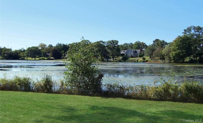 LAKE FRONT  HOME ON A  CUL DE SAC  IS CALLING YOU ..THIS EXANDED - Beach Home for sale in Patchogue, New York on Beachhouse.com
