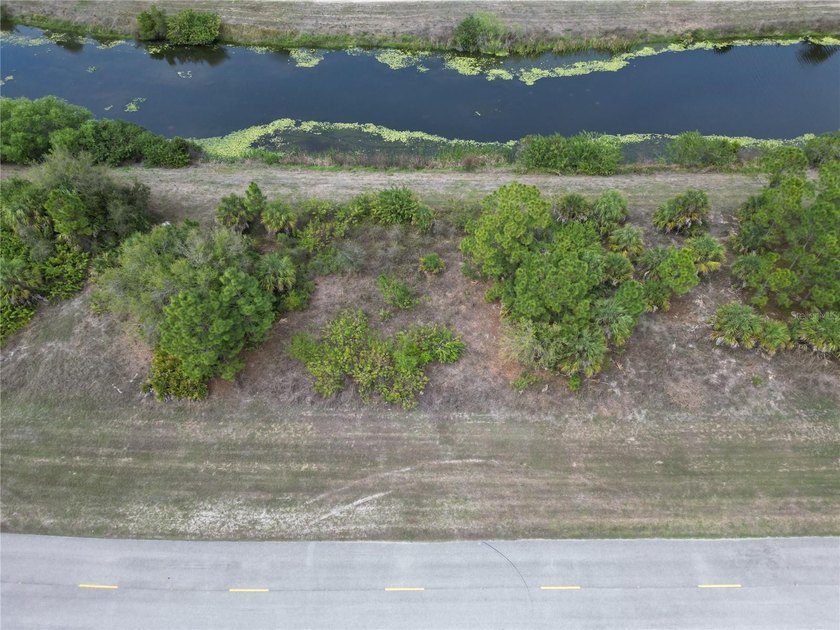 This WATERFRONT 0.27-acre vacant lot on Raintree Blvd offers a - Beach Lot for sale in North Port, Florida on Beachhouse.com