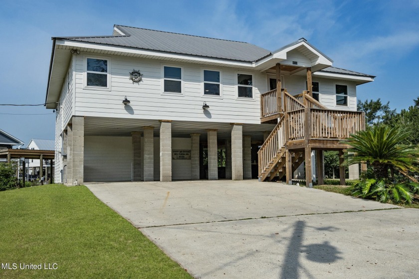 Amazing waterfront home now available! 4 bedrooms (including two - Beach Home for sale in Bay Saint Louis, Mississippi on Beachhouse.com