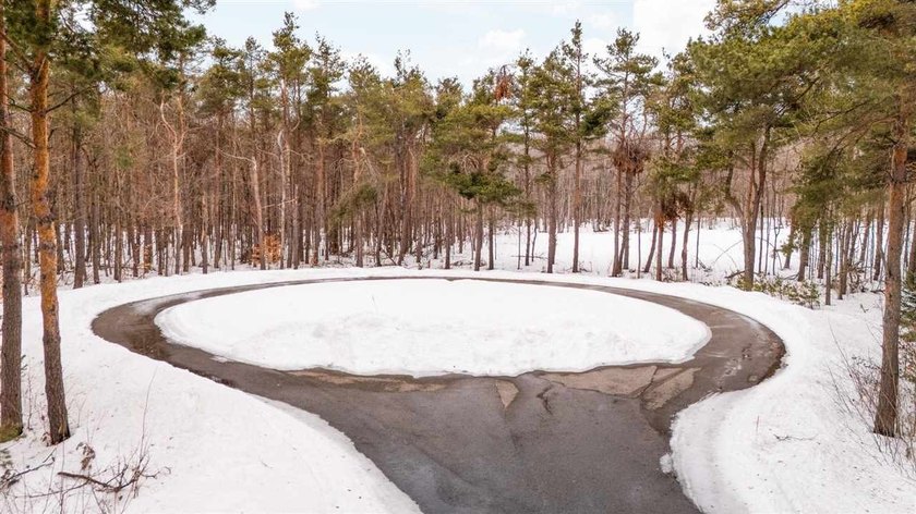 Set within the thoughtfully preserved landscape of True North - Beach Lot for sale in Harbor Springs, Michigan on Beachhouse.com