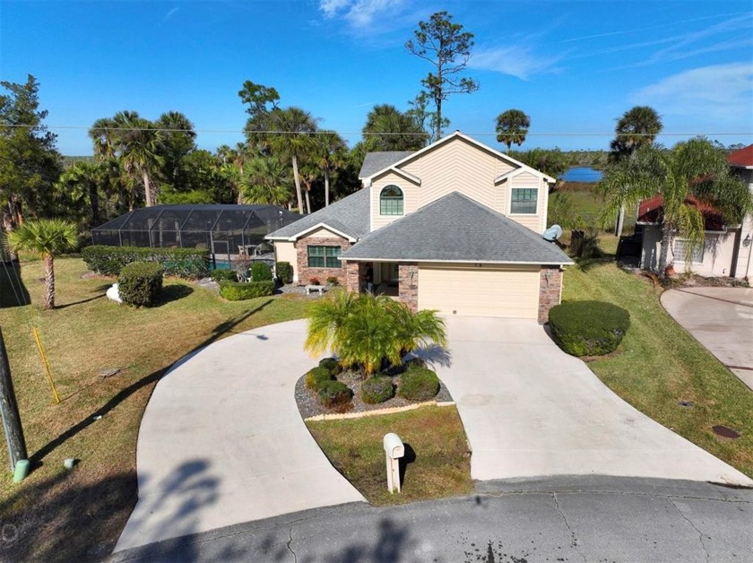 This lovely 2 story pool home sits on the Long Creek Preserve - Beach Home for sale in Palm Coast, Florida on Beachhouse.com