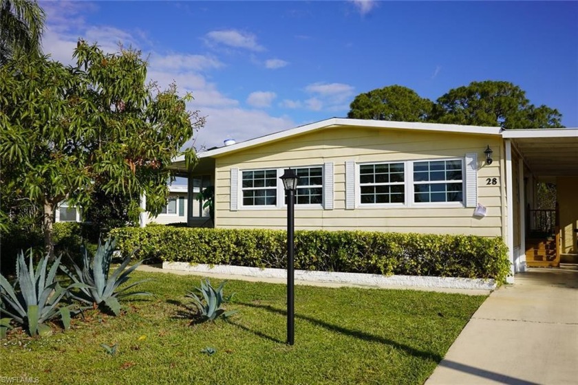 This light-filled home features tile floors throughout and a - Beach Home for sale in Naples, Florida on Beachhouse.com
