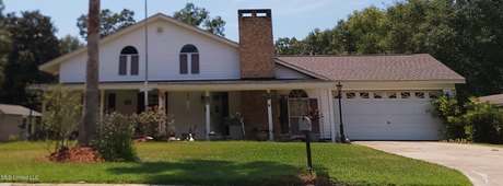 This gorgeous gem has been yard of the month several times!  A - Beach Home for sale in Gautier, Mississippi on Beachhouse.com