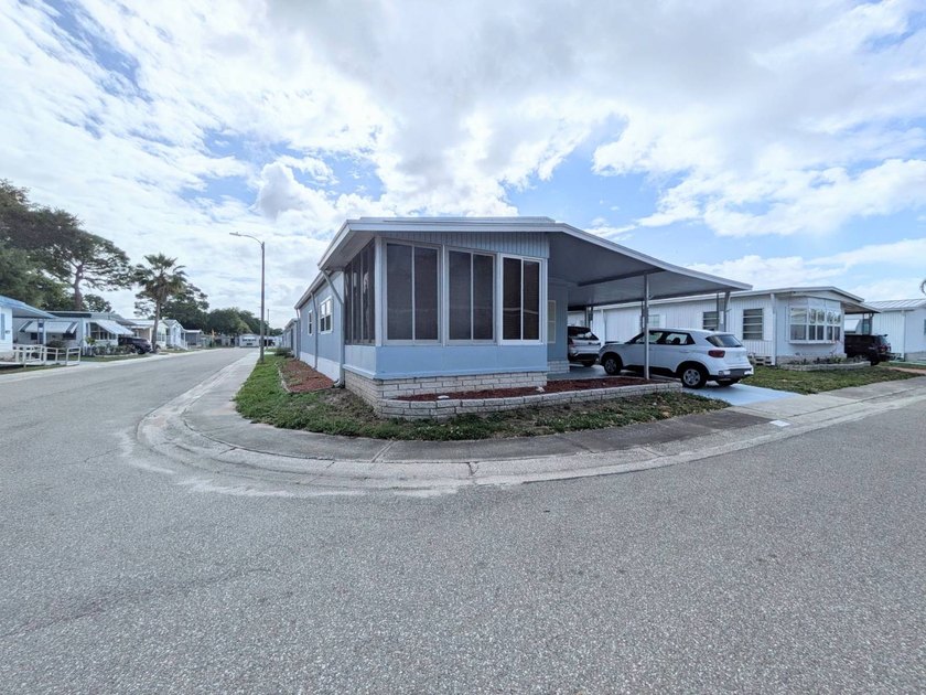 Corner Lot with Enclosed Florida Room. Newer Double Pane Windows - Beach Home for sale in Clearwater, Florida on Beachhouse.com