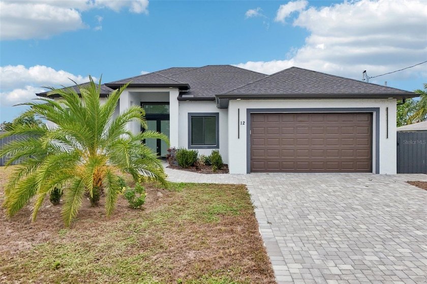 Welcome to this brand new Cape Coral dream home where modern - Beach Home for sale in Cape Coral, Florida on Beachhouse.com