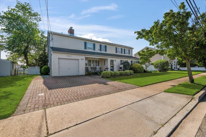 Charming Waterfront Colonial with Legal Mother-Daughter Setup - - Beach Home for sale in Massapequa, New York on Beachhouse.com