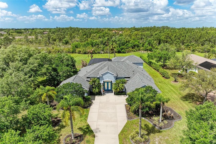 This stunning 5-bedroom, 3.5-bath home with a dedicated office - Beach Home for sale in Bradenton, Florida on Beachhouse.com