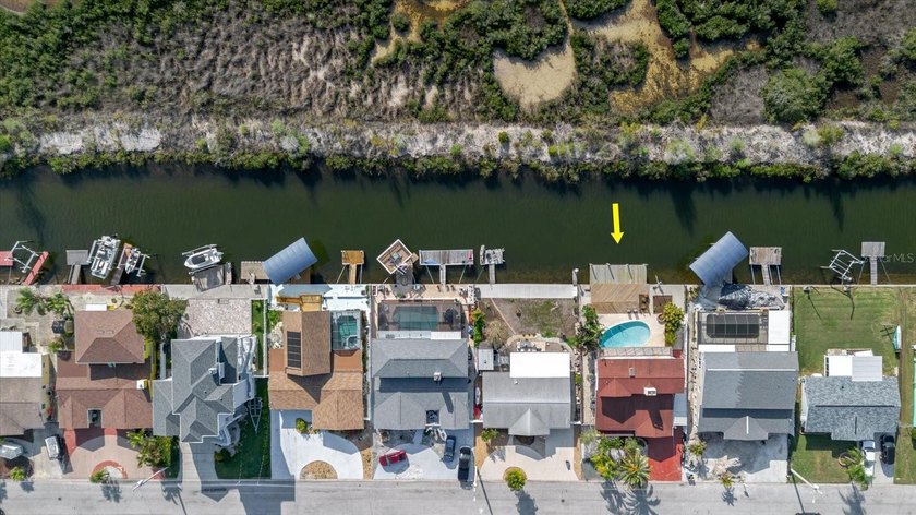 Welcome to 12825 5th Isle in Hudson, FL, a true waterfront gem - Beach Home for sale in Hudson, Florida on Beachhouse.com