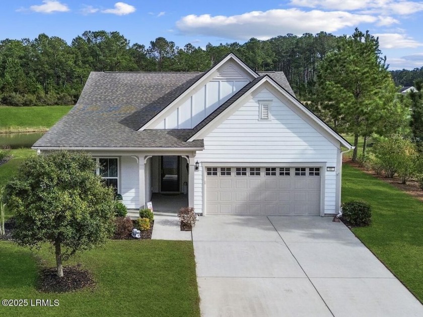 The charming front porch invites you to unwind while watching - Beach Home for sale in Bluffton, South Carolina on Beachhouse.com