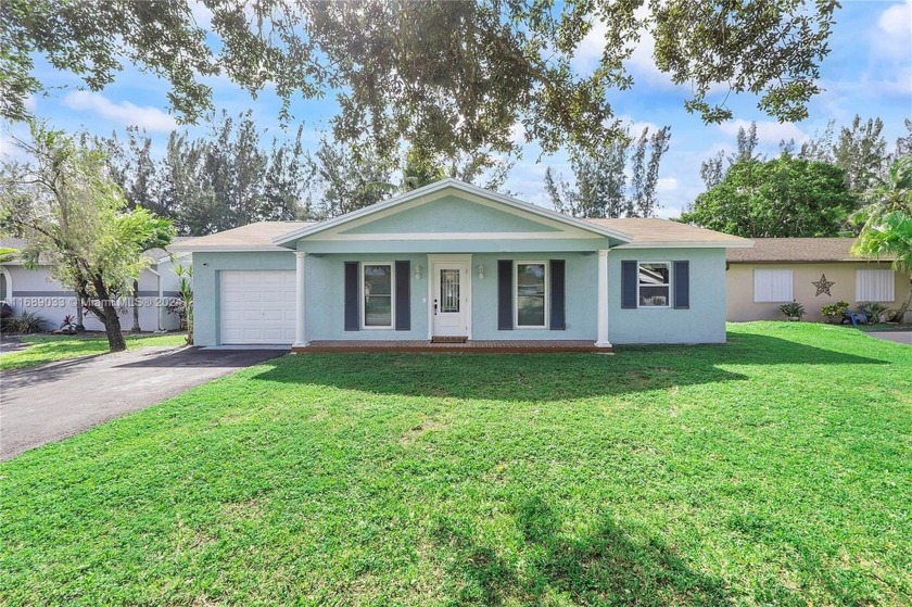 Discover this inviting family home, ideally situated in a - Beach Home for sale in Sunrise, Florida on Beachhouse.com