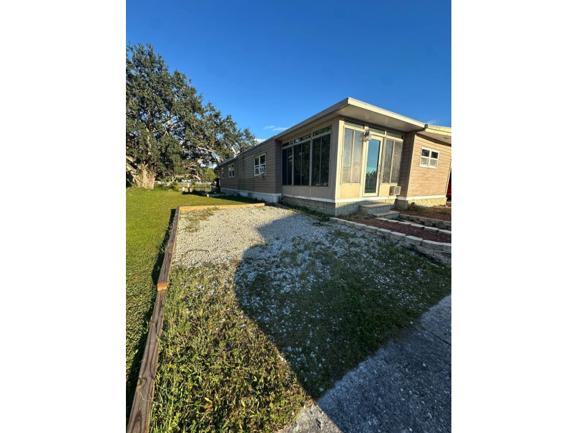 Price Drop!! DOUBLEWIDE Beautiful LAKEFRONT Home! Don't miss - Beach Lot for sale in Pinellas Park, Florida on Beachhouse.com