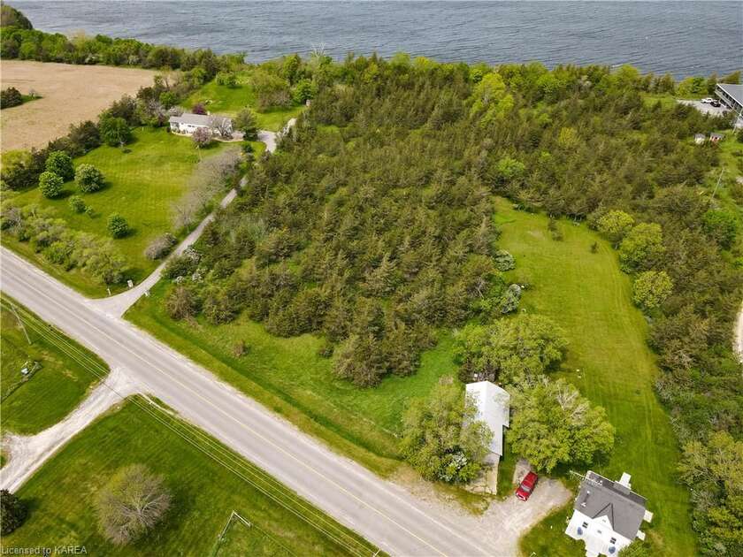 This five acre waterfront Lake Ontario property is the ideal - Beach Lot for sale in Picton, Ontario on Beachhouse.com